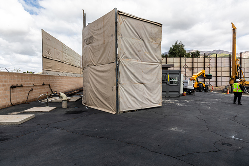 Plant 129 Groundwater well construction. Image of temporary sounds walls around the facility.