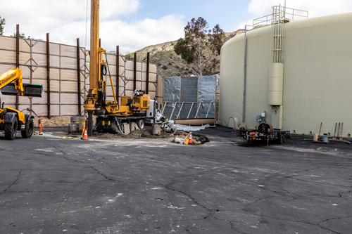 Construction at Plant 129 for the new groundwater well. Heavy equipment drilling for the well wall.
