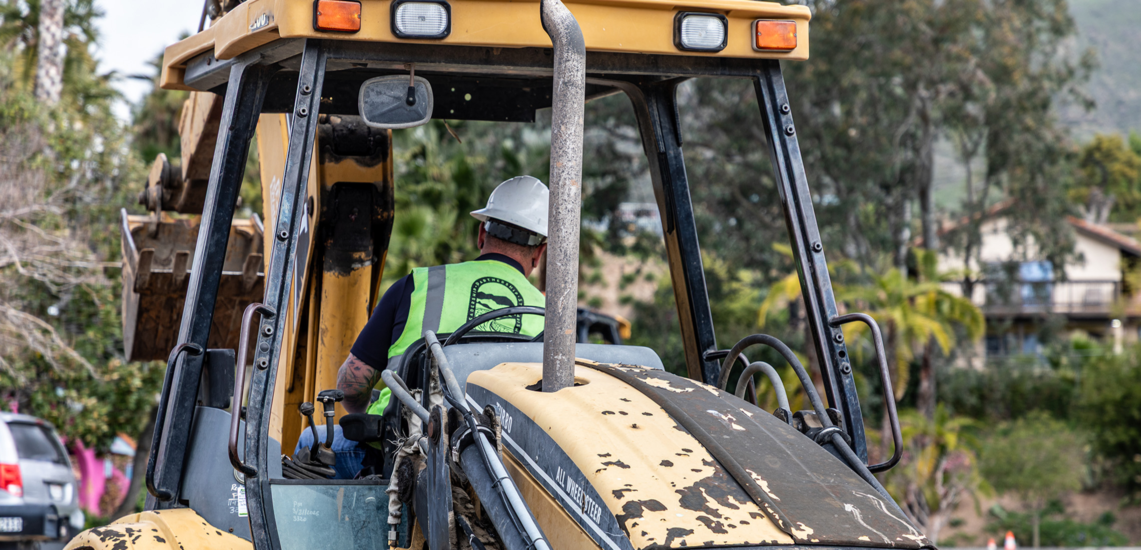 Man driving a backhoe 